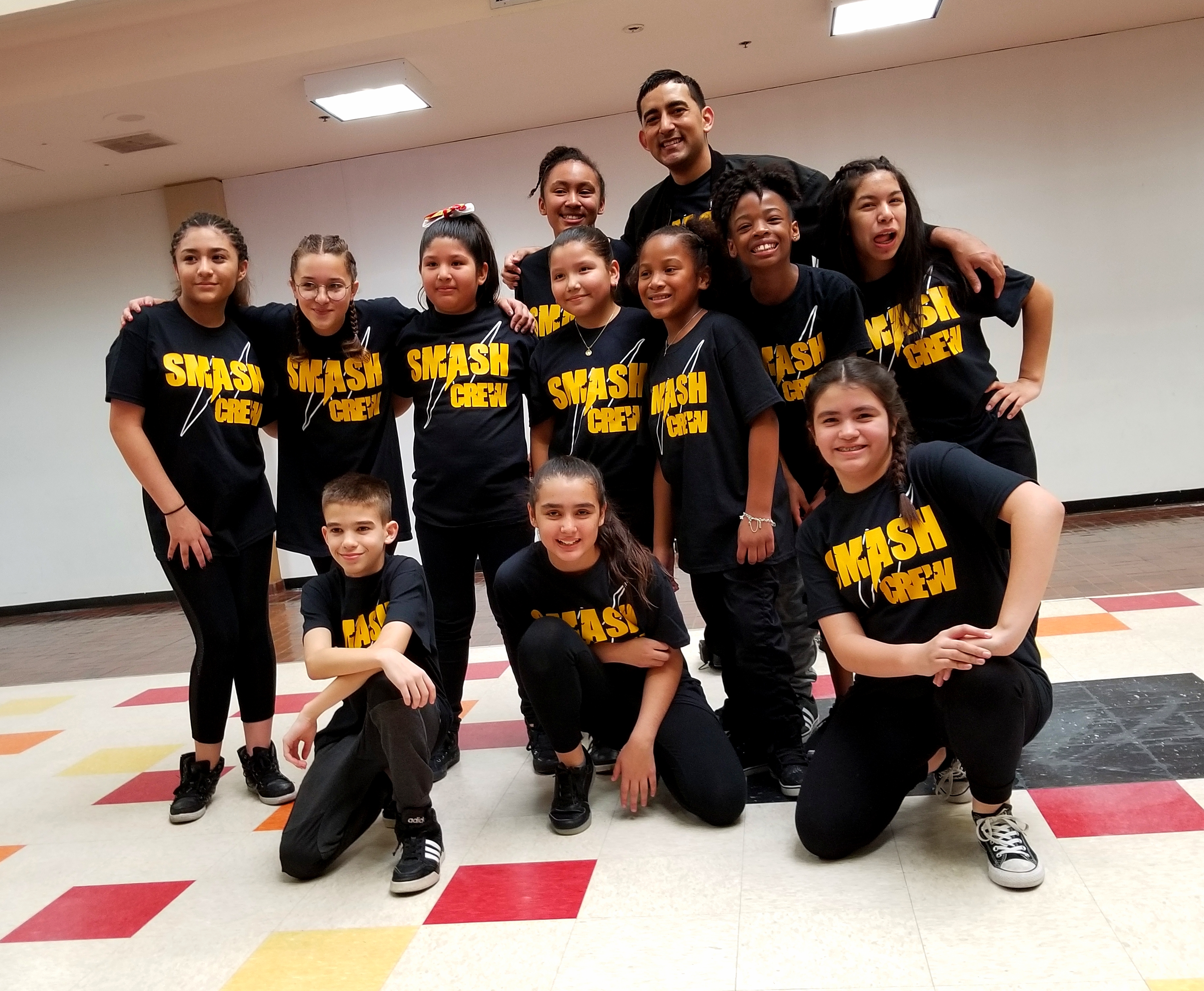 SMASH Crew group at a community performance