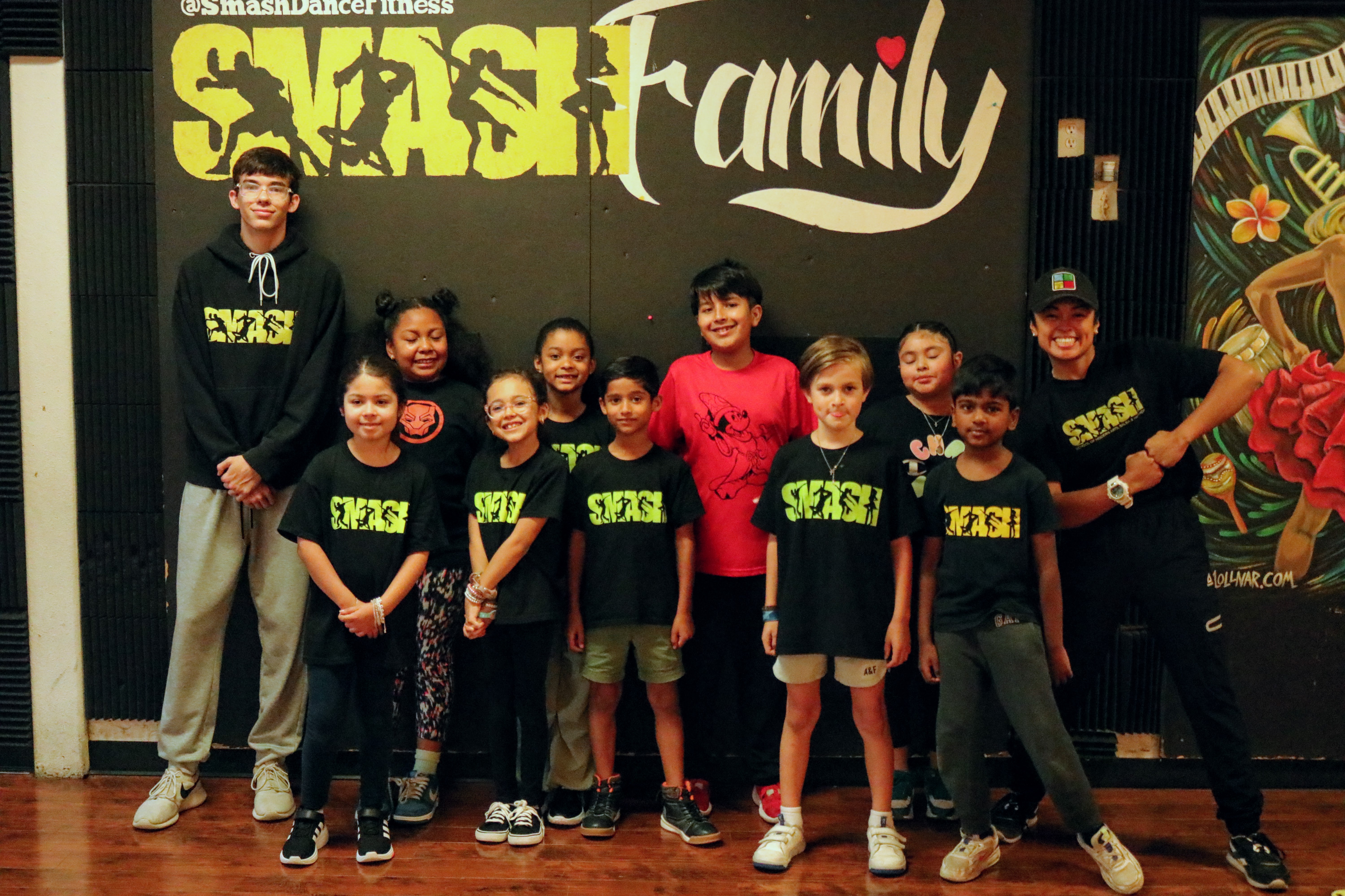 Young SMASH dancers posing at a summer showcase