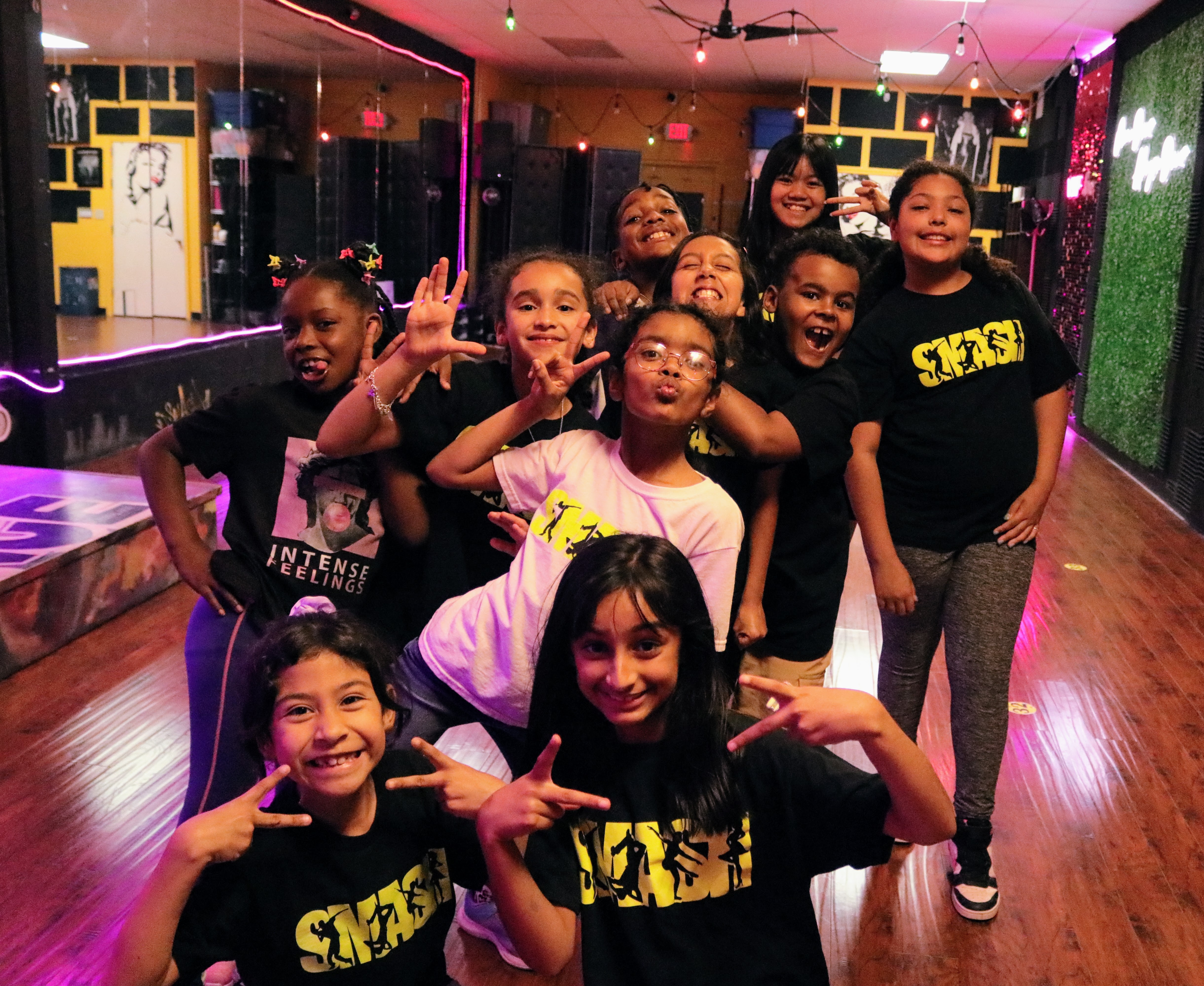 SMASH dancers sharing a joyful group moment