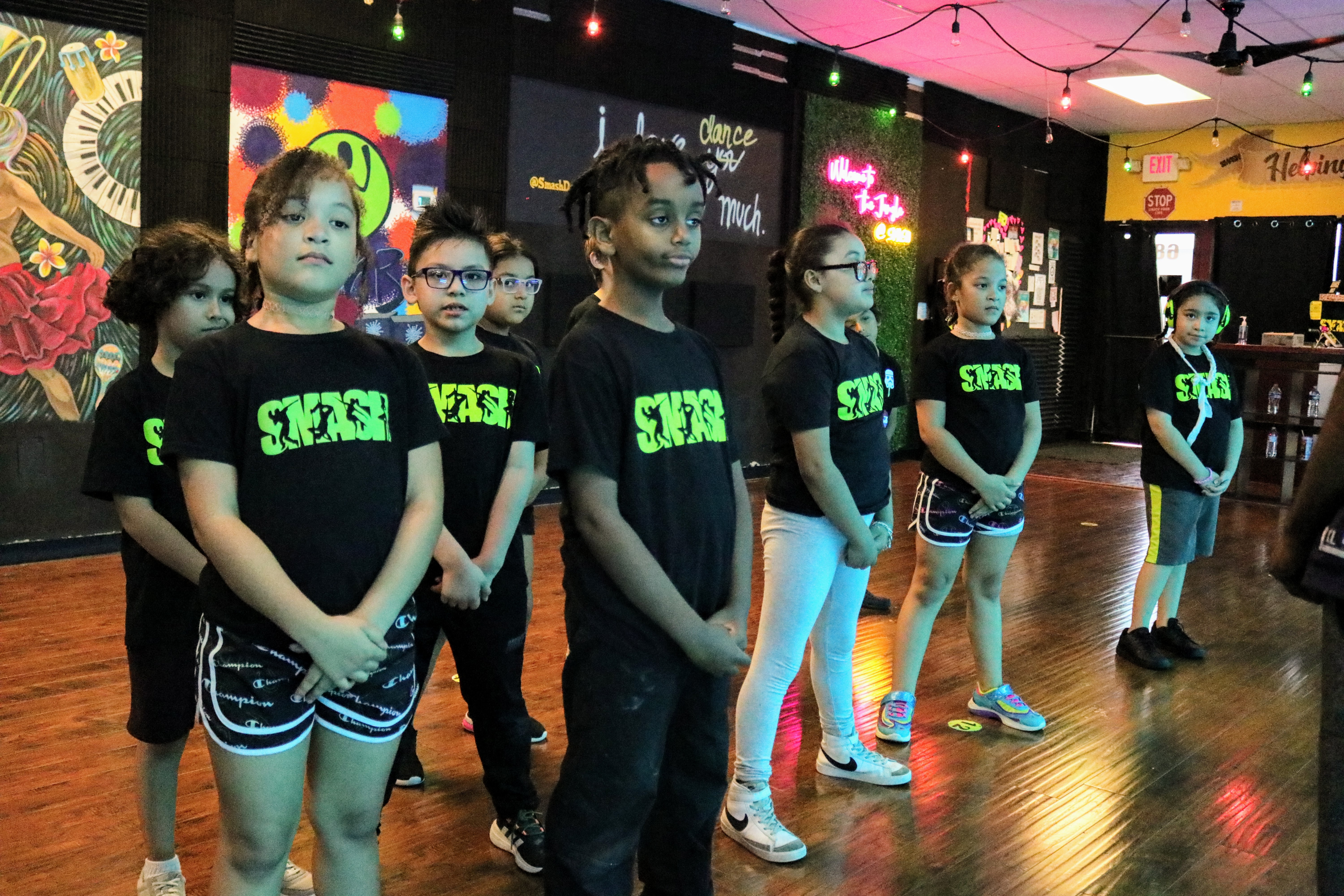 Kids lined up for a dance class at SMASH