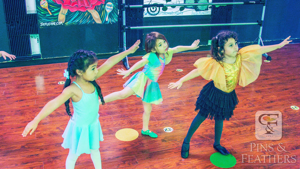 Young dancers practicing ballet poses