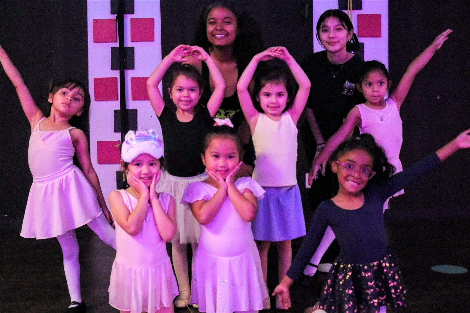 Young dancers and instructors posing together